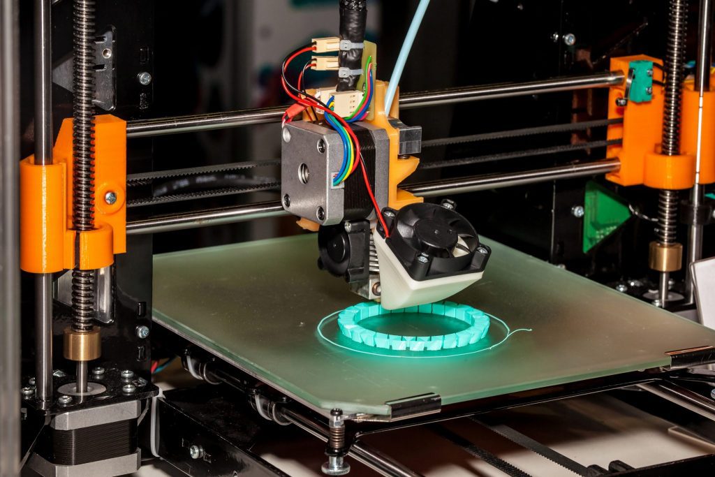 shutterstock_452521486 A 3D printer in the beginning stages of a prototype for a client