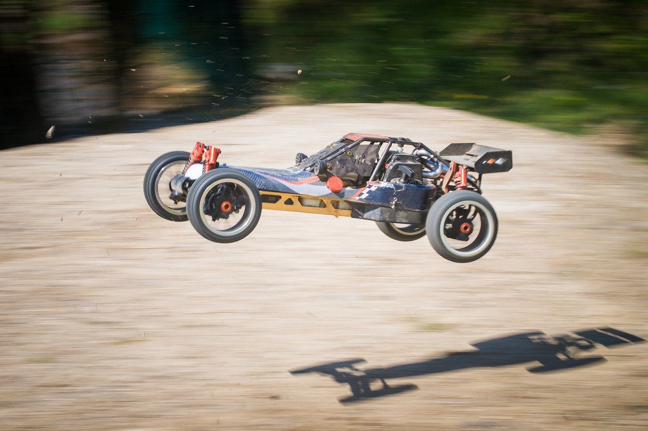 a customer's RC car with 3D Printed Car Parts doing jumps on a dirt course